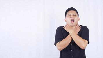 Asian Man Suffering from Sore Throat on White Background photo