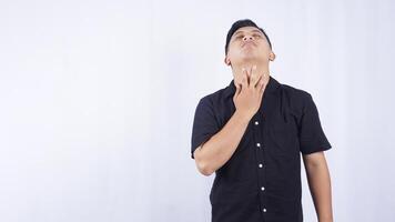 Sick Asian Man Suffering from Sore Throat on White Background photo