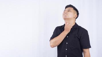 Sick Asian Man with Inflammation in The Throat on White Background photo