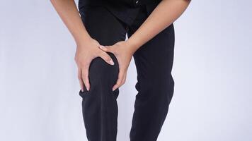 Man with Knee Pain on White Background photo