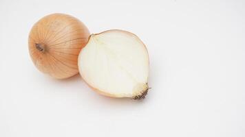 Half Cut and Bulb of Onion on White Background photo