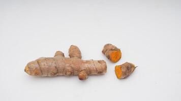 Turmeric Spice Pieces on White Background photo