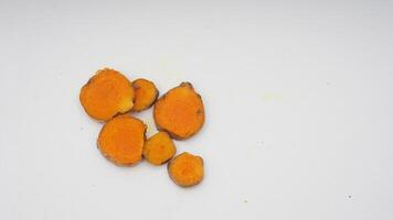 Slice of Turmeric Spice on White Background photo