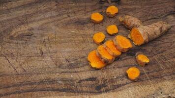 Turmeric Spice on Wooden Textured Background photo