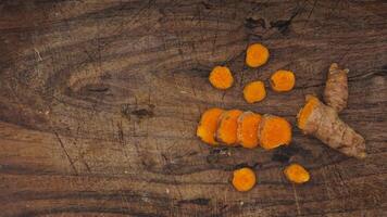 Turmeric Spice on Wooden Cutting Board Background photo