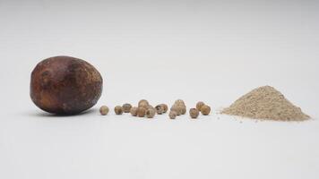 White Peppercorn Raw and Powder and Nutmeg on White Background photo