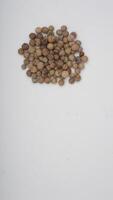 Top View of Peppercorn Spice on White Background photo