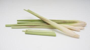 Whole and Slices Lemongrass on White Background photo