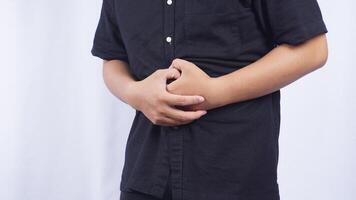 Close Up of Man with Stomach Pain on White Background photo