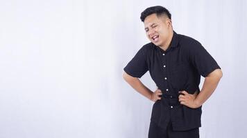 Sick Asian Man with Stomachache on White Background photo