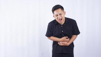 Sick Asian Man with Stomach Pain on White Background photo