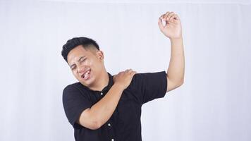 Asian Man with Pain in His Shoulder on White Background photo