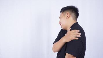 Side View of Asian Man Suffering from Stiff Muscle with Pain on White Background photo