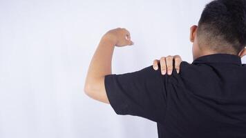 Rear View of Man with Stiff Muscle and Shoulder Pain on White Background photo