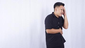 Portrait of Asian Man with Stomach Pain on White Background photo