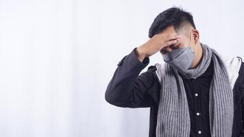 Asian Man Self Massaging His Head to Release Head Pain on White Background photo