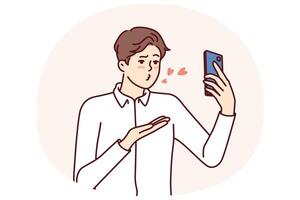 Man with mobile phone sends air kiss to interlocutor during call to girlfriend vector