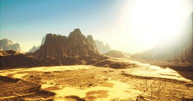 Vast desert landscape under bright sunlight with mountain formations in view video