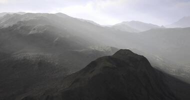 Majestic mountain range enveloped in mist during early morning hours video