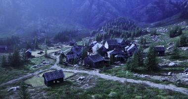 Quiet village nestled in serene mountains during twilight hours video