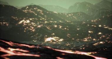 Lava flows create a mesmerizing landscape with glowing patterns video