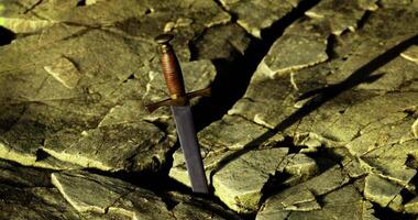 Sword embedded in rocky terrain with dramatic lighting and textures video