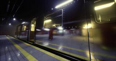 Urban subway station during nighttime with glowing train and empty platform video