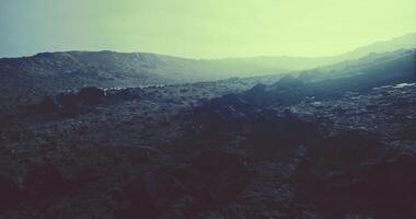 Expansive rocky terrain under an ethereal sky at dusk video