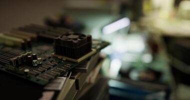 Close up of a computer motherboard with components on a workbench video