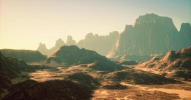 Desert landscape with mountains and rocky formations during golden hour video