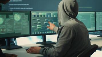 Governmental hackers doing teamwork in protecting sensitive information from cyber threats of digital mercenaries. Experts focusing on online security and cyber defense tactics. Camera A. photo