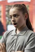 Angry teenager revealing emotional issues and bullying related stress, challenges the therapist in a rebellious confrontation. Counseling focuses on managing aggression and rudeness. Close up. photo