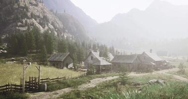 Quiet morning in a rustic mountain village surrounded by tall trees video