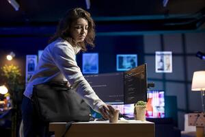 Programmer holding cup of coffee in the morning, securing company servers from virus attacks. IT remote employee with hot beverage starting work, building firewalls protecting data photo
