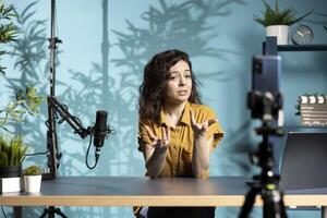 Content creator streaming to large audience, using professional equipment to ensure crisp sound and quality. Media star filming viral , having conversation with subscribers photo