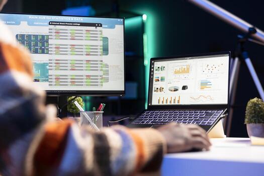 Young financial advisor examines monthly income and expenses to ensure a strategic plan on products and services. African american expert analyzing revenue balance, accounting analysis at home. photo