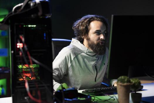 Man plays intense videogame tournament online during stream with fans, spamming attack buttons. Player participating in esports competition during livestream, pressing hard on keyboard keys photo