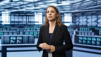 System administrator in high tech data center looking at hologram visualization. Computer scientist working on securing server terminals using AR tech, preventing hacker attacks, camera A photo