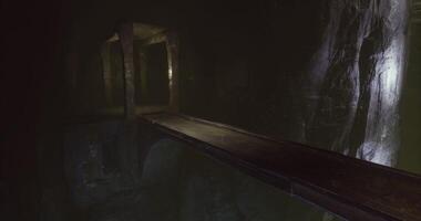 Mysterious underground pathway illuminated by faint light sources video