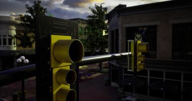 Traffic lights hang on a pole above a bustling intersection in a city video
