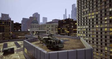 Helicopter on city rooftop during dusk with skyscrapers in background video