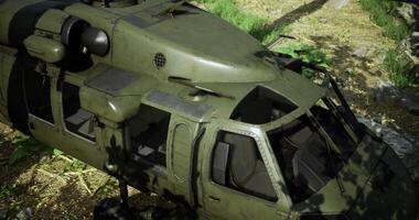 Military helicopter on forest floor during daytime operations in a dense jungle video