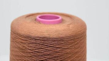 Spool of Brown Thread on White Background video