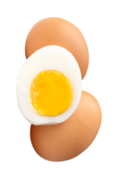 A vertical pile of two raw chicken eggs and peeled cooked or boiled egg with egg yolk in half in stack isolated with clipping path in file format png