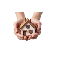 A person holds a small white model house with windows and a door in their hands, symbolizing home ownership and real estate investment. png