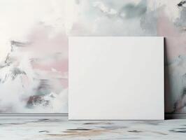 A blank canvas against a softly colored abstract wall, inviting creativity and artistic expression. photo