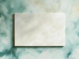 A blank canvas mounted on a textured wall, inviting creativity and artistic expression. photo