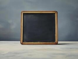 A blank chalkboard in a wooden frame, ready for writing or drawing. photo