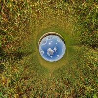 A view of the sky through a hole in the ground photo