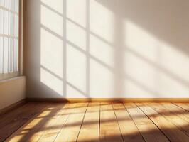 A sunlit corner of a room with wooden flooring and shadow patterns on the wall. photo